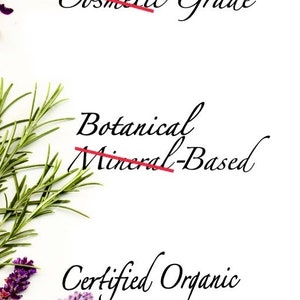 May include: A white background with three phrases written in black cursive script. The phrases are crossed out with a red line. The first phrase is "Food Cosmetic Grade". The second phrase is "Botanical Mineral-Based". The third phrase is "Certified Organic Organic Ingredients".