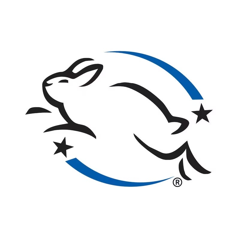 May include: A white rabbit leaping, outlined in black, within a blue arc, with two black stars. The logo is a symbol of cruelty-free products, often found on cosmetics and household items.