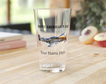May include: A clear glass with a personalized design featuring a North American P-51D Mustang airplane. The text "NORTH AMERICAN P-51D" and "Your Name Here" is printed on the glass.
