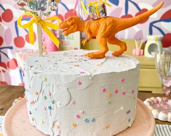 Colourful dinosaur party cake topper