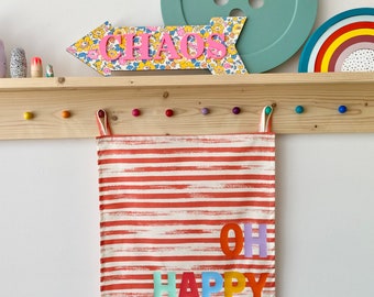 Fabric wall banner hanging with rainbow lettering