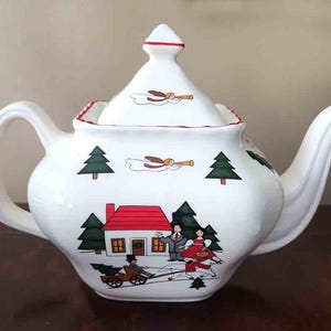 May include: A set of three ceramic mugs with a speckled, matte finish. The mugs are in shades of cream, light gray, and dark gray. Each mug has a simple, minimalist design, perfect for coffee or tea.