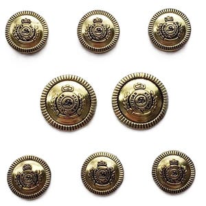 May include: Eight antique brass-colored buttons with a detailed design. Each button features a central emblem surrounded by a laurel wreath and a crown, with the text "STAFFORD" visible. The buttons are round with a ridged edge.