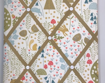 Handmade fabric notice board in woodland fabric