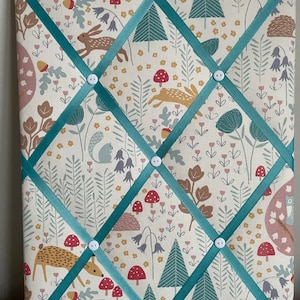 Handmade fabric notice board in woodland fabric