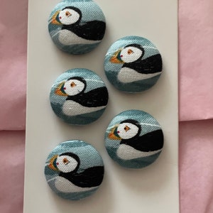 Handmade fabric buttons in a puffin fabric