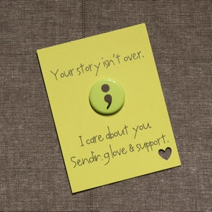 May include: A yellow card with the text "Your story isn't over." and a green button with a black semicolon. The card also has the text "I care about you. Sending love & support." and a small heart.