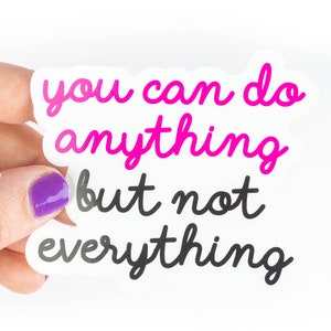 May include: A white sticker with the text "You can do anything but not everything" in pink and black cursive lettering.