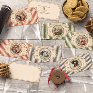 May include: A set of six Christmas gift tags featuring various illustrations of animals and people in winter scenes. The tags are printed on a cream-colored paper with red, green, and blue stripes. The tags are all rectangular and have a scalloped edge. The text on the tags reads "Only for the best" and "Maison Clement".