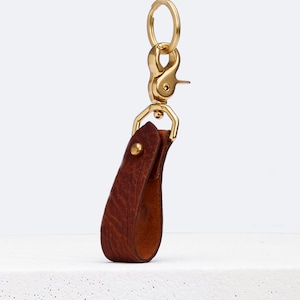 Keychain in awesome Bison Horween leather Tan color\ sewn with a solid brass ring \ Attached to the belt