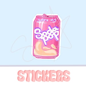 May include: A pink sticker featuring a cartoon soda can design. The can has the words "You're my Soda Pop" in white and purple. The word "STICKERS" is written in pink at the bottom.