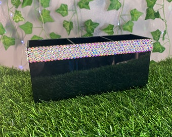 Blinged out black make up storage.