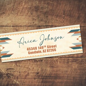 May include: A white address label with a geometric pattern in shades of blue, orange, and gray. The label has the text "Arica Johnson" and the address "45348 149th Street Goodwin, AZ 87266".