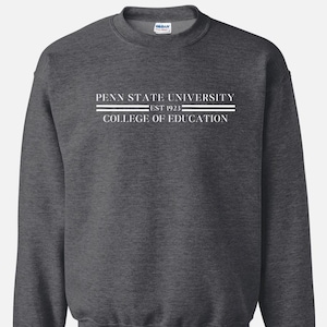 May include: Dark heather gray sweatshirt with white text that reads "Penn State University Est 1923 College of Education".