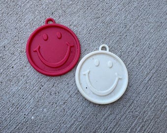 WINTAGE! 2 plastikowe ciężarki do balonów Zibi Core w kształcie uśmiechniętej buźki, 1991