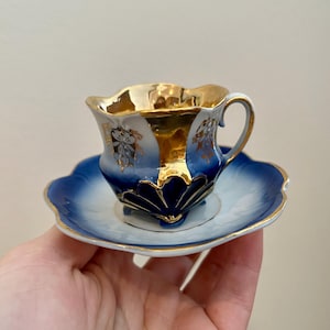 VINTAGE! Dainty German Cobalt Blue, White and Gold Porcelain Teacup and Saucer