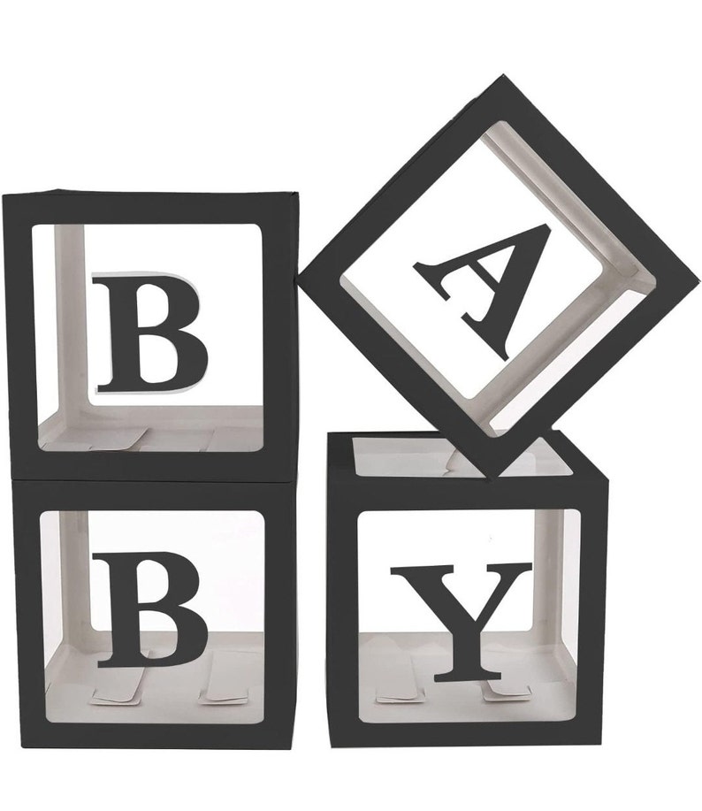 May include: Black and white 'BABY' block balloons. Each letter is in a clear plastic box with a black border.