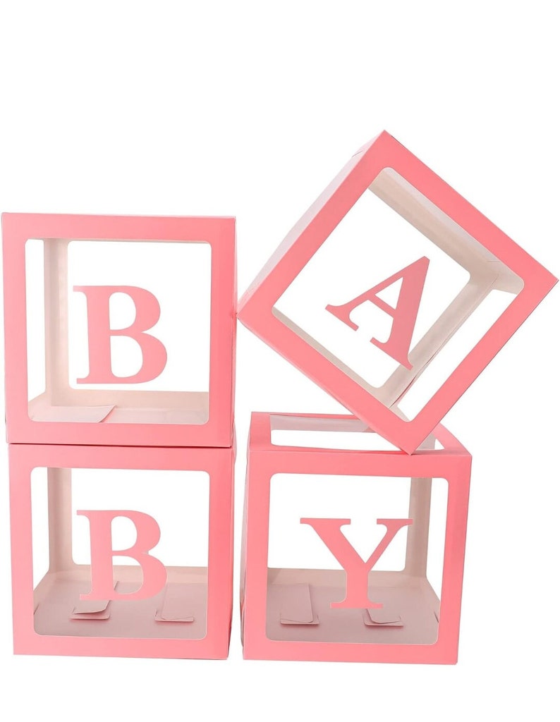 May include: Four pink, clear plastic boxes with the letters "BABY" spelled out. Each box has a white background and the letters are cut out of the plastic.