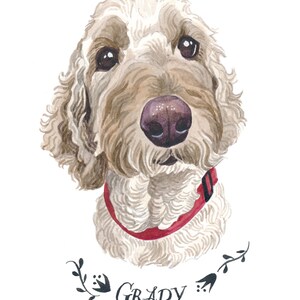 May include: Watercolor portrait of a dog with light brown fur, a red collar, and a dark pink nose. The dog's name, "Grady," is written in cursive below the portrait, with floral accents.