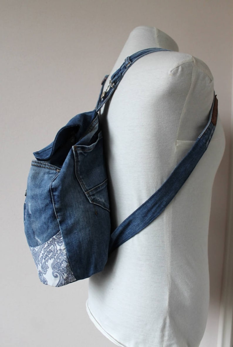 Handmade upcycled one of a kind denim backpack with beautiful barok lining