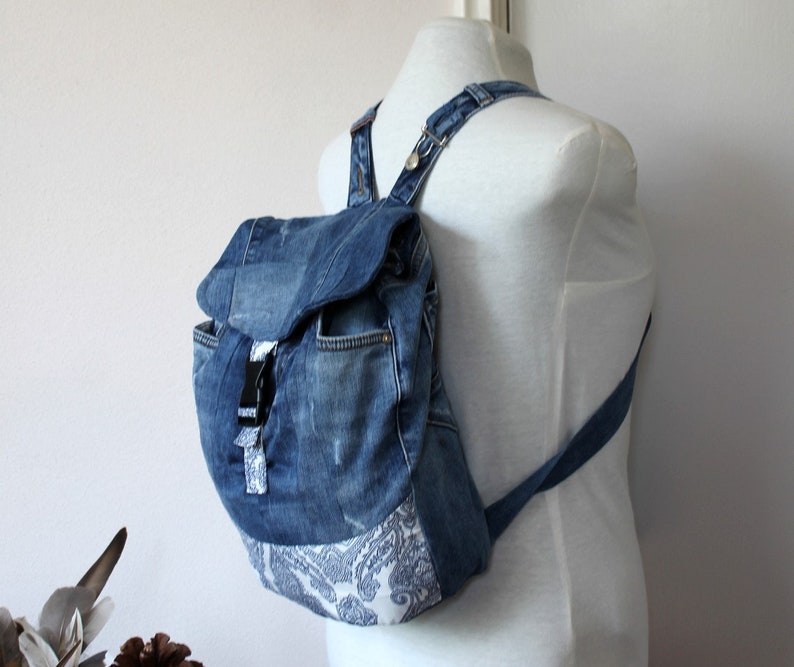 Handmade upcycled one of a kind denim backpack with beautiful barok lining