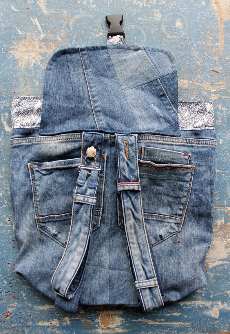 Handmade upcycled one of a kind denim backpack with beautiful barok lining