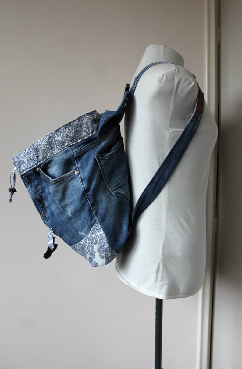 Handmade upcycled one of a kind denim backpack with beautiful barok lining