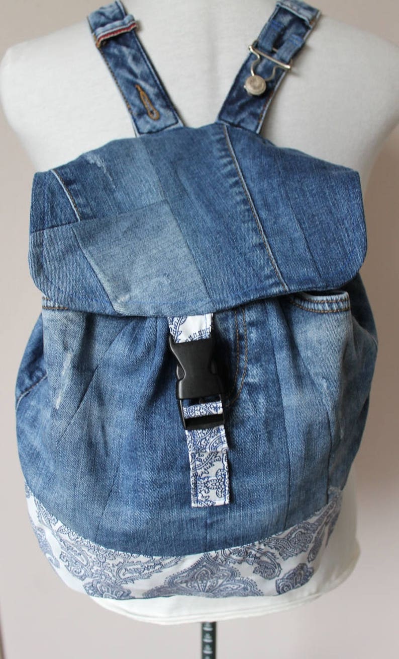 Handmade upcycled one of a kind denim backpack with beautiful barok lining