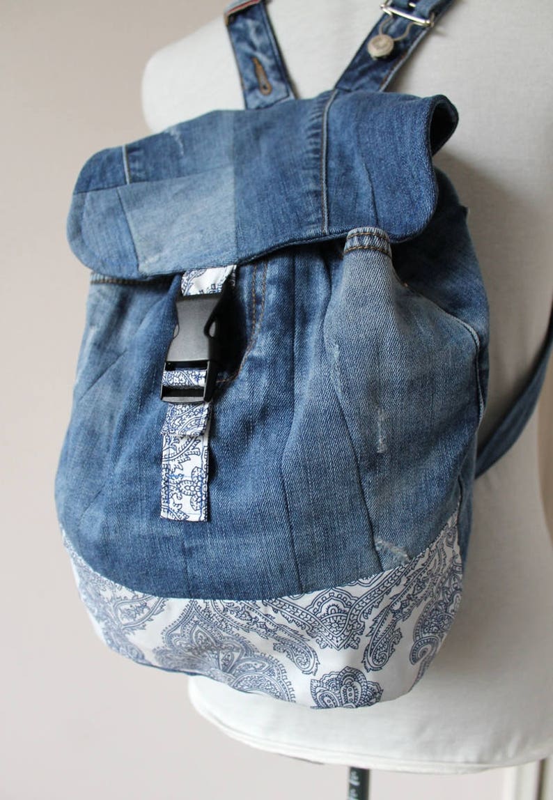 Handmade upcycled one of a kind denim backpack with beautiful barok lining