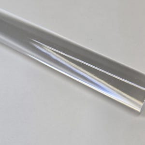 May include: A clear acrylic rod with a smooth, polished surface.