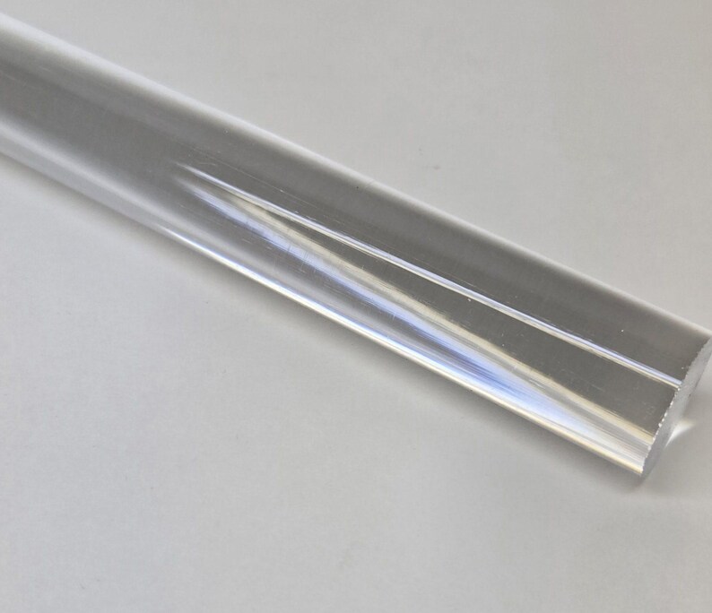 May include: A clear acrylic rod with a smooth, polished surface.