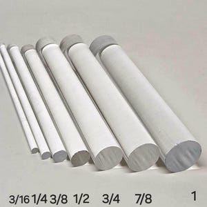 May include: A set of eight clear acrylic rods of varying diameters, labeled with their respective sizes in inches: 3/16, 1/4, 3/8, 1/2, 3/4, 7/8, and 1.