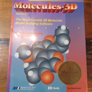 May include: A software box for Molecules-3D, version 2.1, featuring a 3D molecular model on a purple and blue background. The box includes the text "The Most Flexible 3D Molecular Model Building Software" and a "Macintosh" sticker.