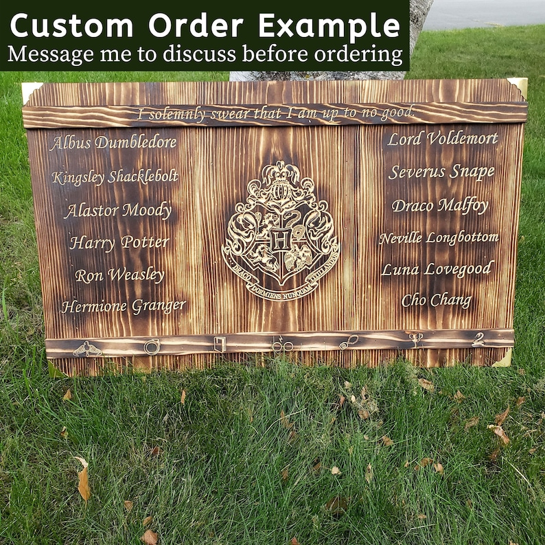 May include: A custom-made wooden sign with a dark, burnt finish. The sign features the Hogwarts crest and character names from the Harry Potter series, including Albus Dumbledore and Lord Voldemort. The text "Custom Order Example" is at the top.