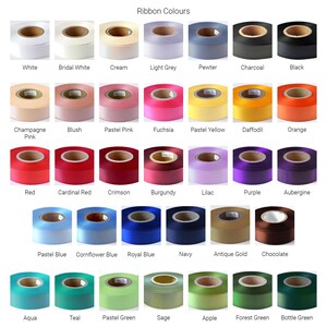 May include: A collection of ribbon spools arranged in a grid, labeled with color names including White, Bridal White, Cream, Light Grey, Pewter, Charcoal, Black, Champagne Pink, Blush, Pastel Pink, Fuchsia, Pastel Yellow, Daffodil, Orange, Red, Cardinal Red, Crimson, Burgundy, Lilac, Purple, Aubergine, Pastel Blue, Cornflower Blue, Royal Blue, Navy, Antique Gold, Chocolate, Aqua, Teal, Pastel Green, Sage, Apple, Forest Green, and Bottle Green.