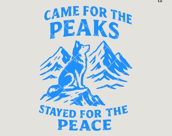 May include: A blue graphic design featuring a husky dog sitting on a mountain, with the text "CAME FOR THE PEAKS STAYED FOR THE PEACE". The design includes mountain silhouettes and is a digital download.