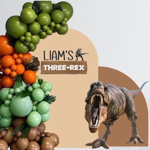 May include: A green, orange, and brown balloon arch with a sign that reads "Liam's Three-Rex" and a dinosaur cutout.