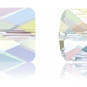 May include: A square and round crystal bead with a multi-colored iridescent finish. The bead has a light blue, green, yellow, and pink color scheme. The bead is called "Allium Blue".