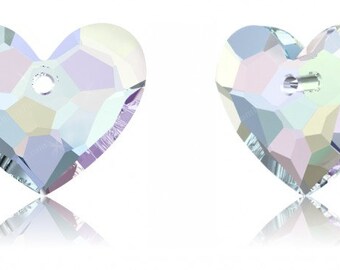 May include: Two iridescent clear crystal heart-shaped pendants with a hole at the top for stringing or attaching.