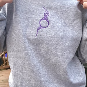 the orb embroidered crewneck