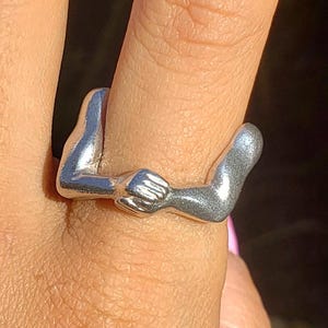 flexing arms ring