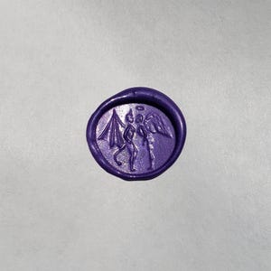 May include: Purple wax seal with an image of an angel and a devil standing back to back.