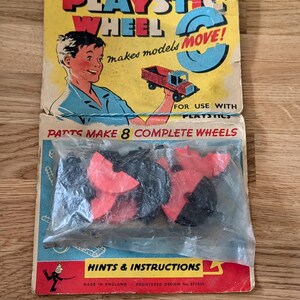 May include: Vintage "Playstic Wheel" toy set packaging. The yellow and red packaging features a boy holding a toy truck. The package includes red and black wheel parts. The text reads "makes models MOVE!" and "HINTS & INSTRUCTIONS." Made in England.