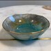 Kelly reviewed 3” Seafoam, Gold,  Light Gray, Ocean Blue Bowl with Hand-painted Gold Rim Accent and Flecks of Iridescent Sparkle