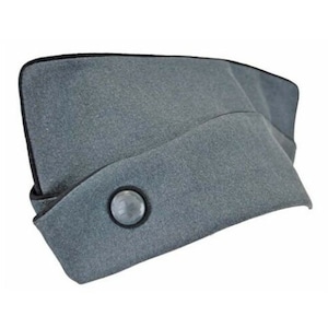 May include: A gray military-style cap with a black trim and a silver button. The cap has a slightly pointed shape and a flat top.