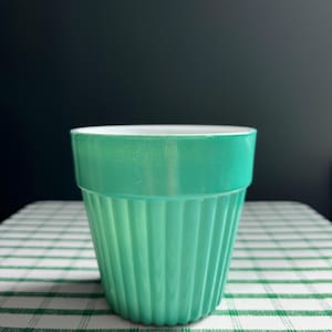 May include: A set of three ceramic mugs with a speckled, matte finish. Each mug features a different color: light blue, cream, and gray. The mugs have a simple, modern design, perfect for coffee or tea.