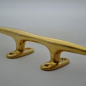 Brass Four Hole Cleat 8" in a Polished Finish