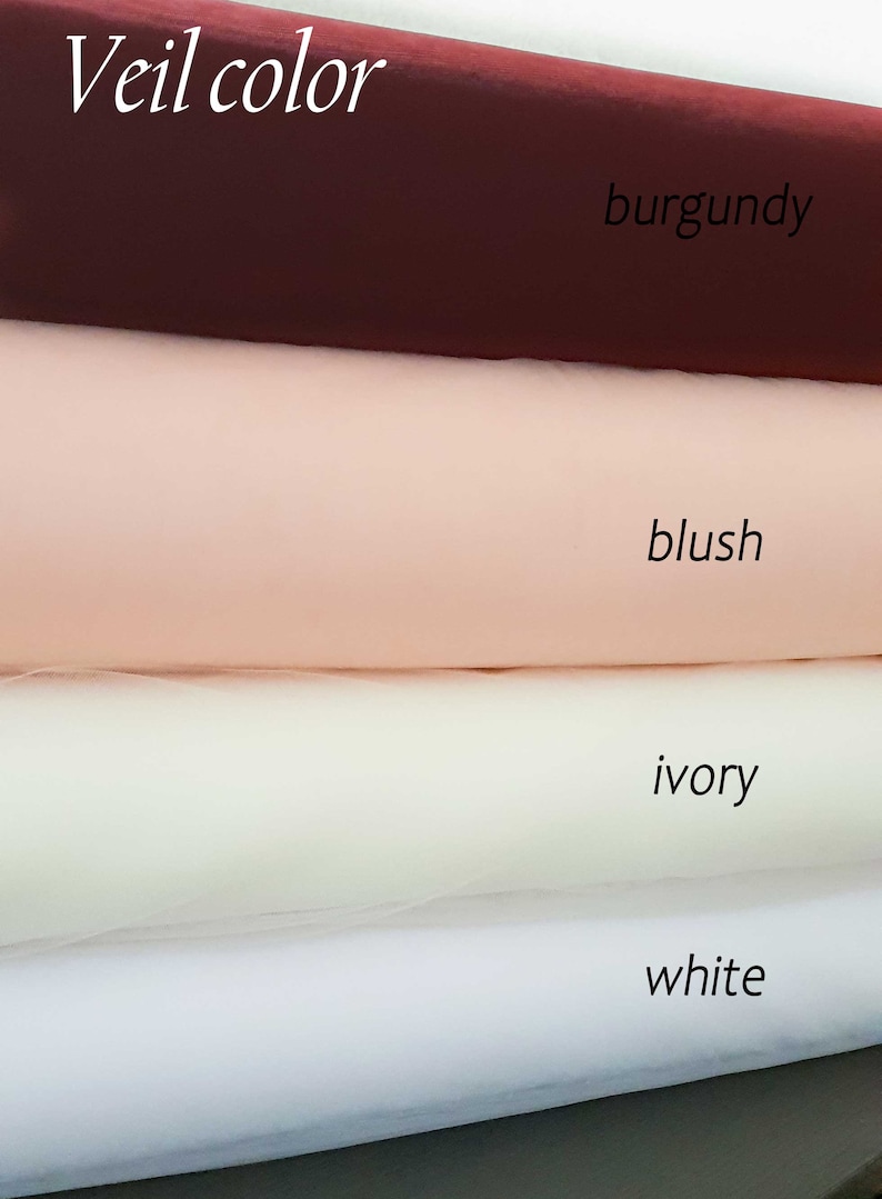 May include: Four swatches of tulle fabric in different colours: burgundy, blush, ivory, and white. The fabric is arranged in a stack, with the burgundy swatch on top and the white swatch on the bottom. The text "Veil colour" is written above the swatches.