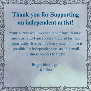 a message of gratitude from Bright Blessings - Katrina, expressing appreciation for supporting an independent artist. The message emphasizes that the purchase allows the artist to continue creating more art and that the buyer is very grateful for the opportunity to support independent artists and small business owners. The message is framed with an ornate border, adding a decorative touch to the overall presentation.