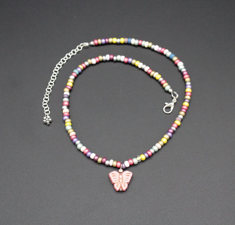 Butterfly charm necklacemulti-color glass beadspink howlite butterflygift for herboho teen giftinsect charmadjustablecasualfun